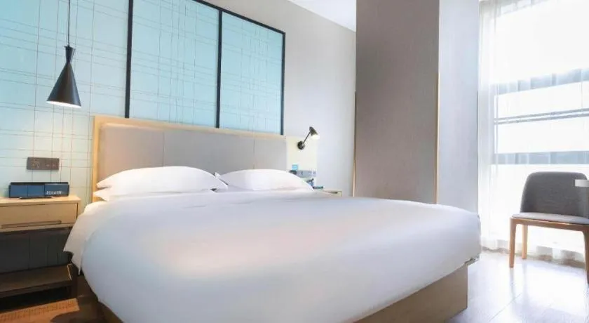 Bed in Echarm Hotel Hefei West Qilitang Metro Station