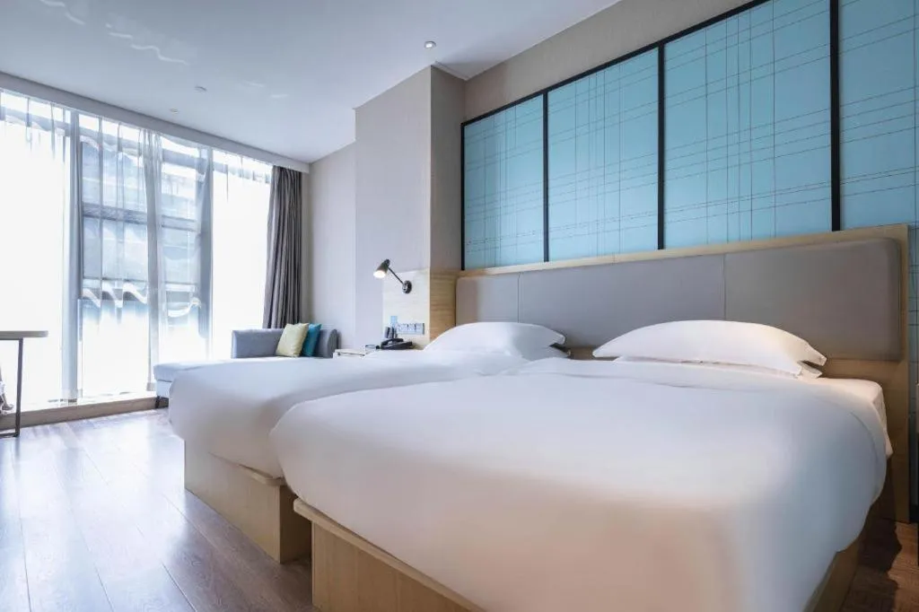 Bed in Echarm Hotel Hefei West Qilitang Metro Station