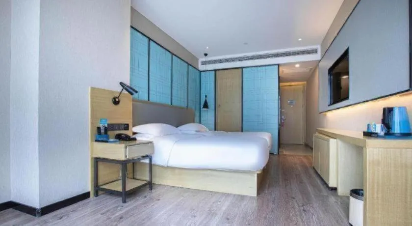 Bed in Echarm Hotel Hefei West Qilitang Metro Station
