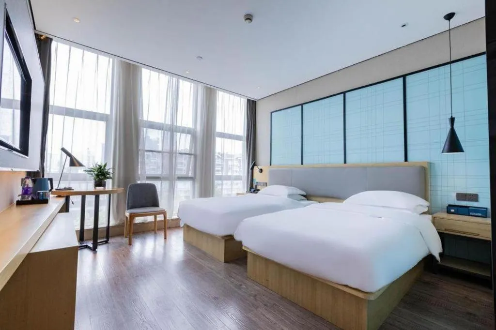 Bed in Echarm Hotel Hefei West Qilitang Metro Station