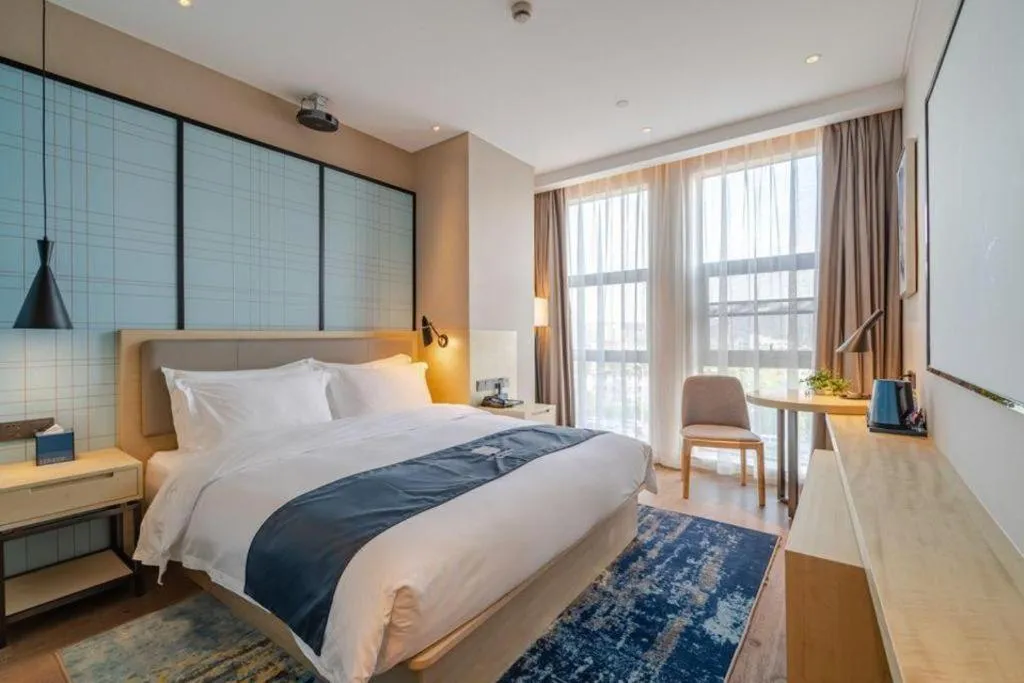 Bed in Echarm Hotel Hefei West Qilitang Metro Station