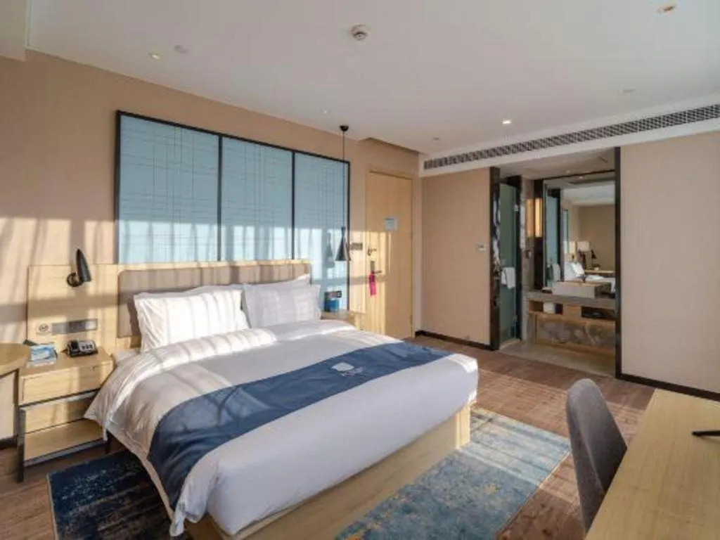 Bed in Echarm Hotel Hefei West Qilitang Metro Station