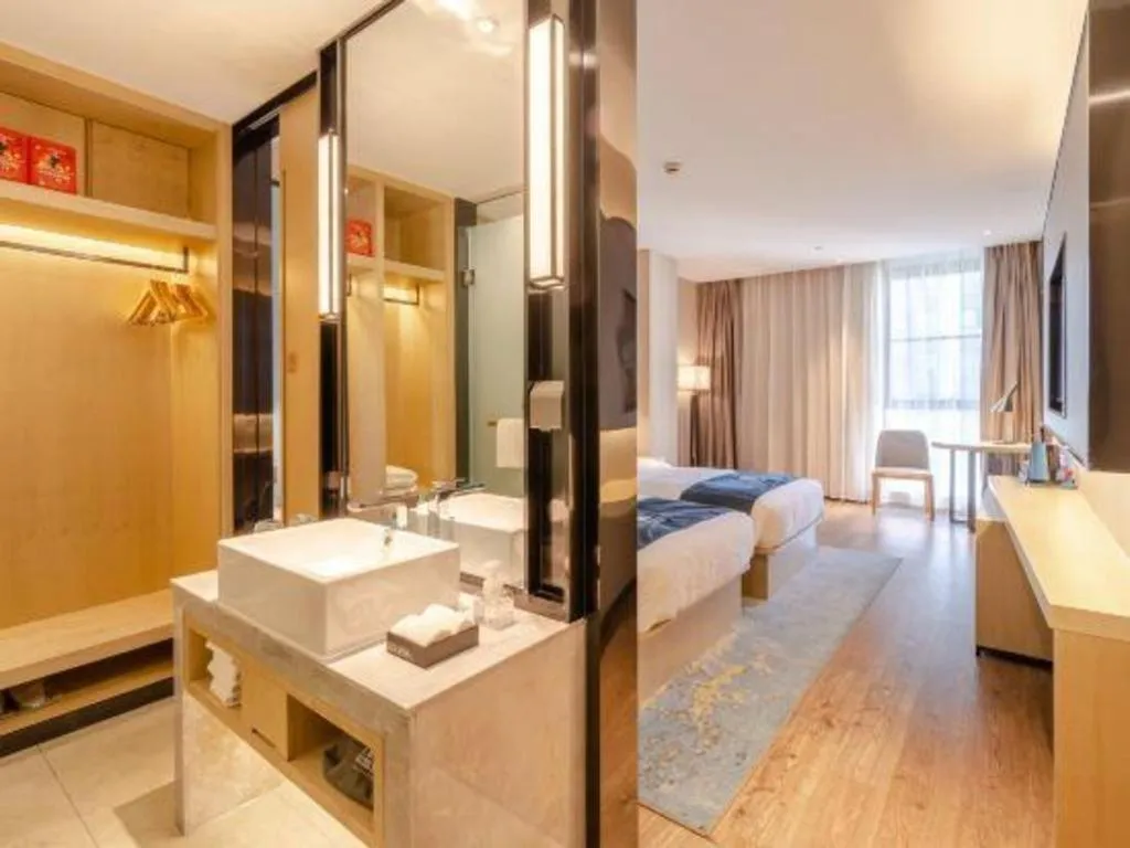 Bed in Echarm Hotel Hefei West Qilitang Metro Station