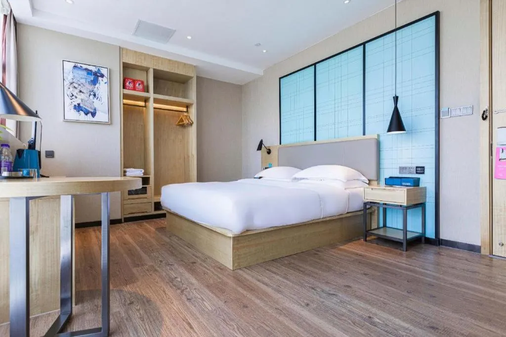 Bed in Echarm Hotel Hefei West Qilitang Metro Station