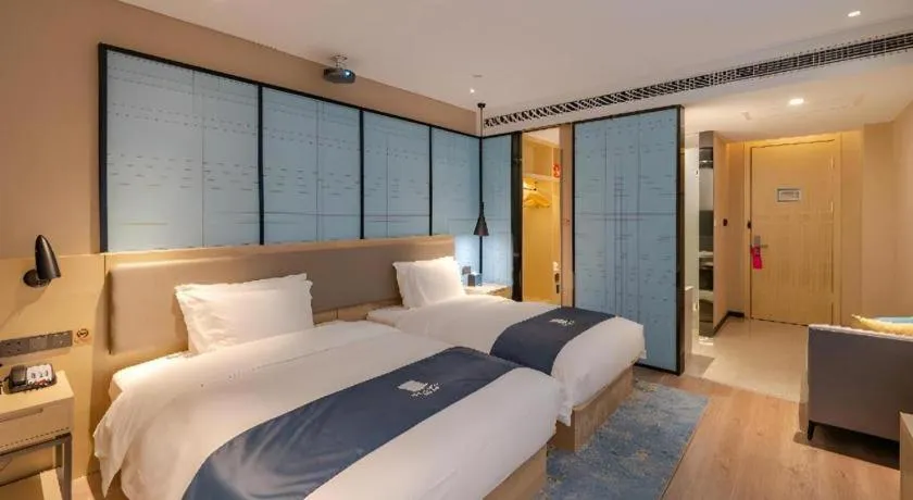 Bed in Echarm Hotel Hefei West Qilitang Metro Station