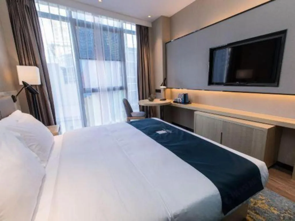 Bed in Echarm Hotel Hefei West Qilitang Metro Station