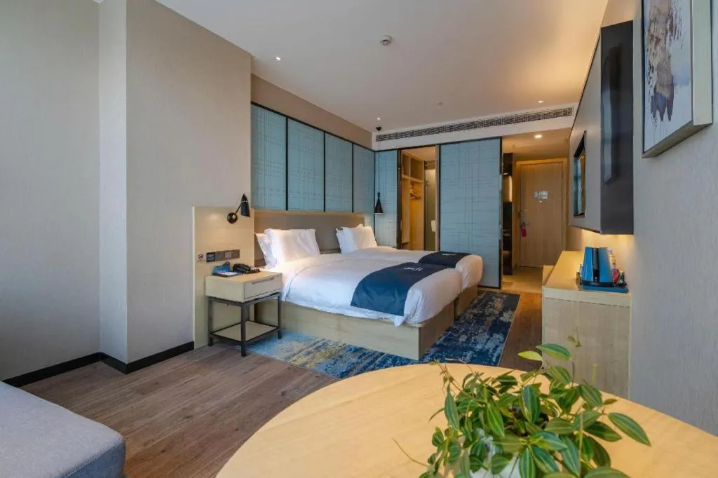 Bed in Echarm Hotel Hefei West Qilitang Metro Station