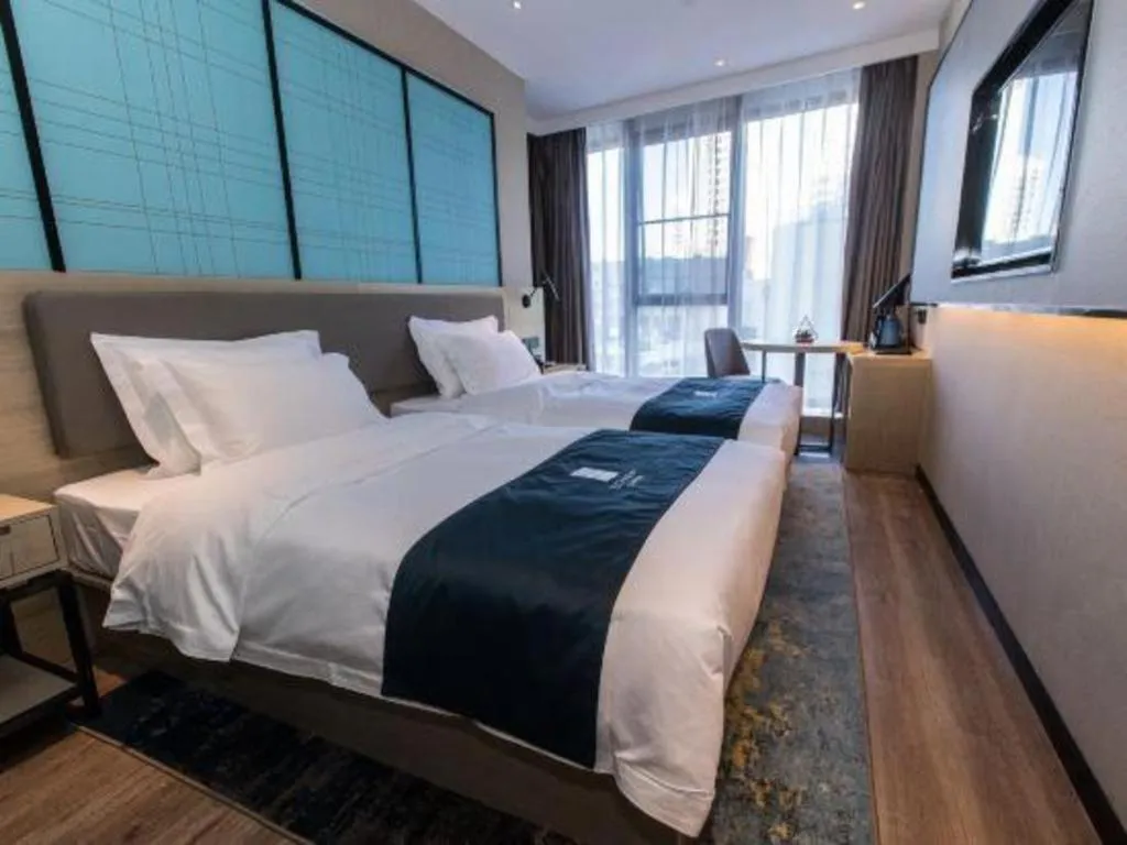 Bed in Echarm Hotel Hefei West Qilitang Metro Station