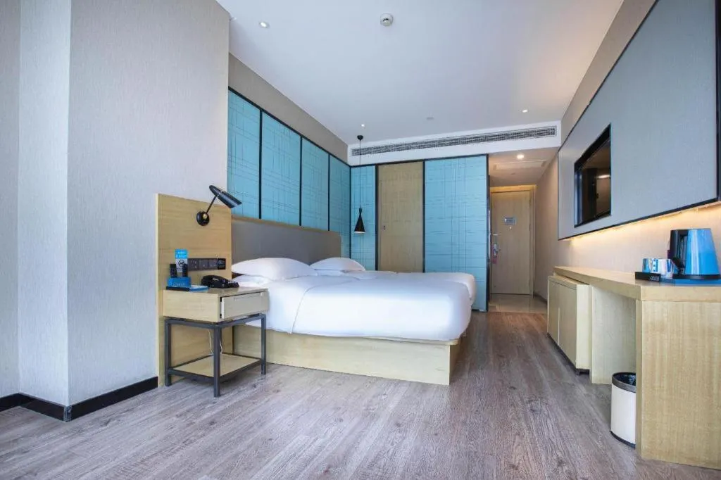 Bed in Echarm Hotel Hefei West Qilitang Metro Station