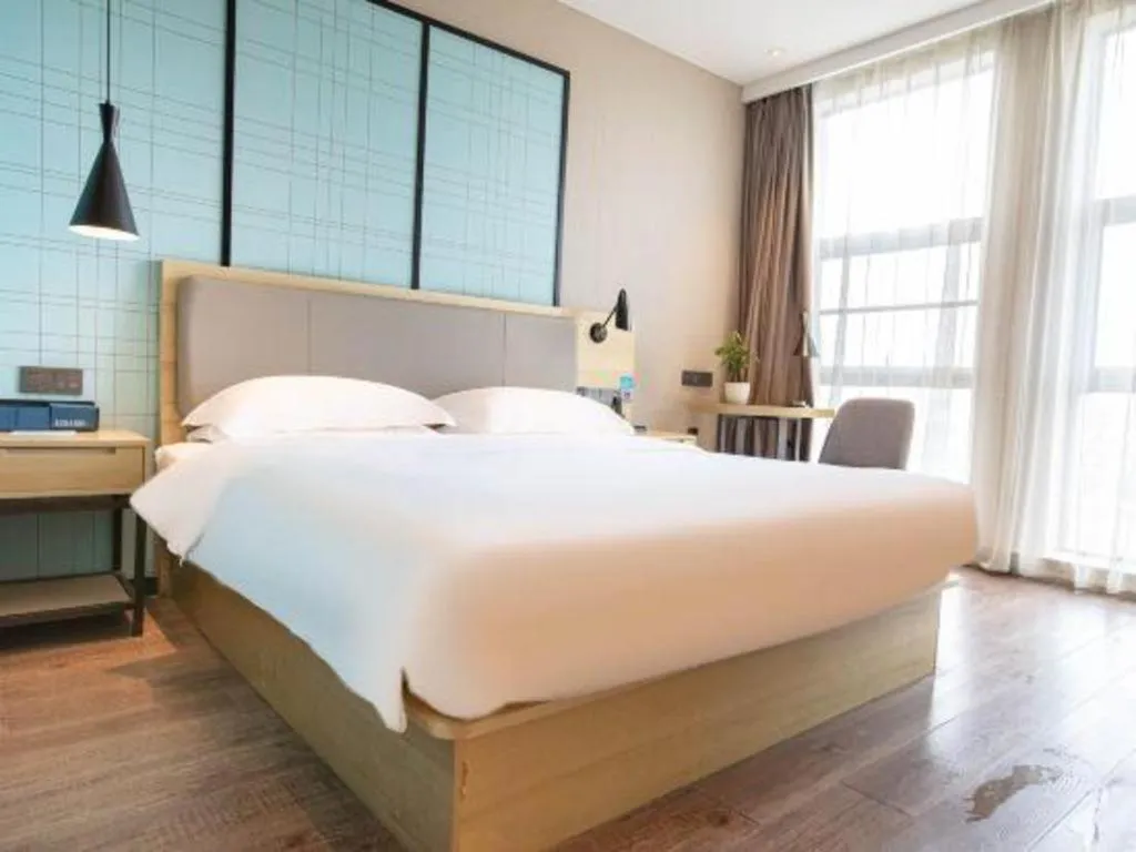 Bed in Echarm Hotel Hefei West Qilitang Metro Station