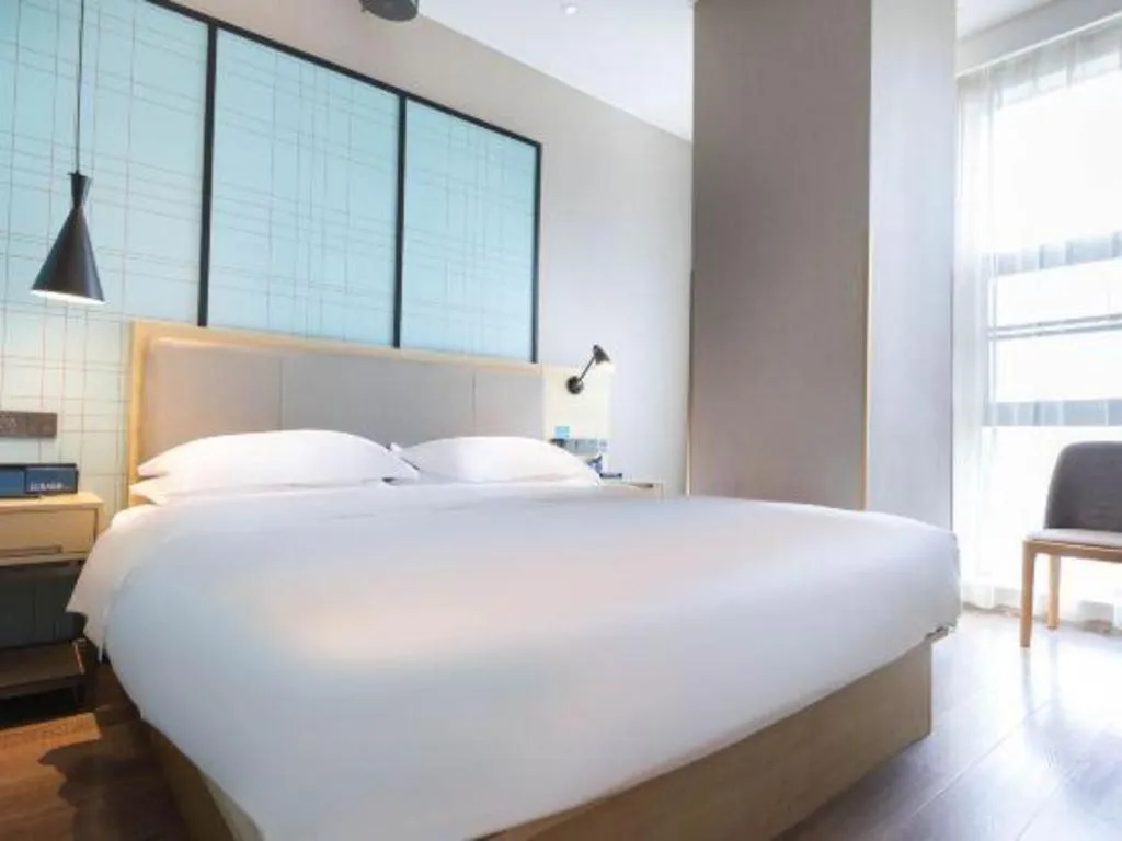 Bed in Echarm Hotel Hefei West Qilitang Metro Station