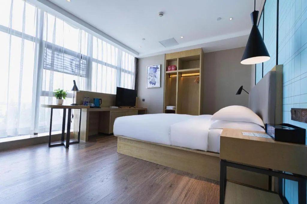 Bed in Echarm Hotel Hefei West Qilitang Metro Station