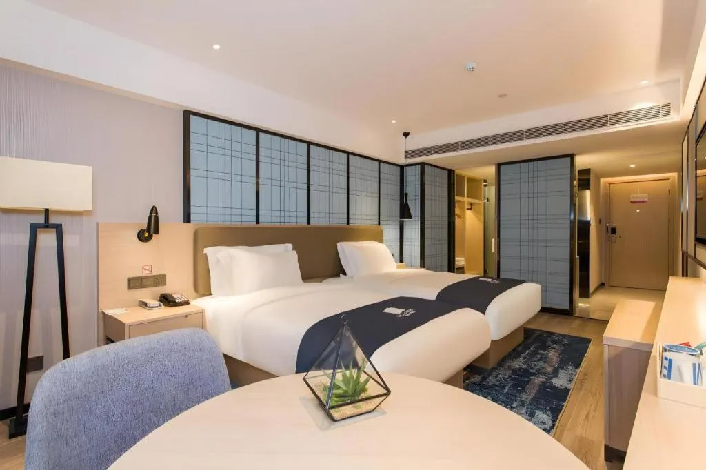 Bed in Echarm Hotel Changsha Xiangya Fushan