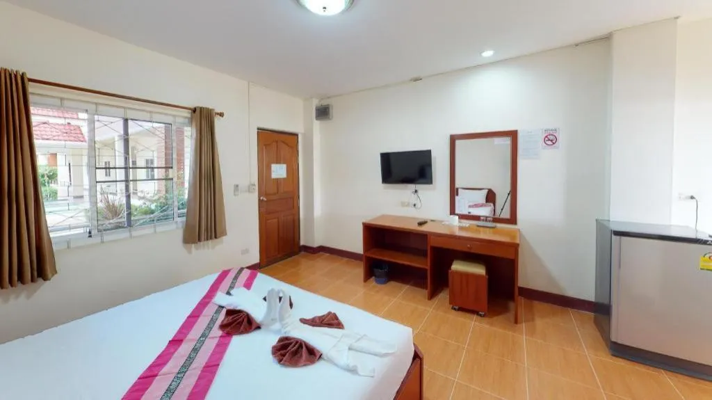 Bed in SC Palace Chiangrai Hotel