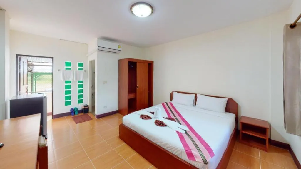 Bed in SC Palace Chiangrai Hotel