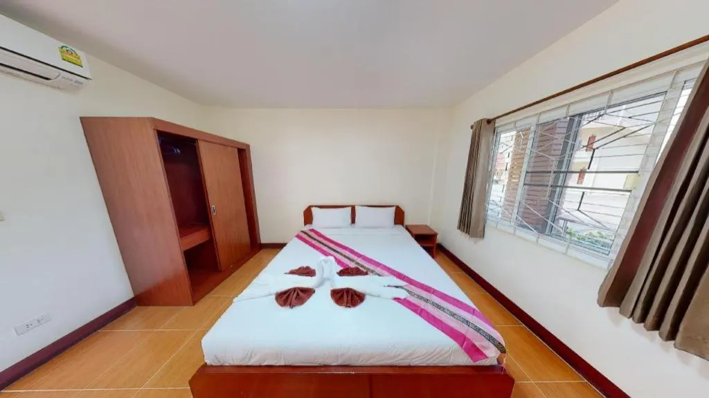 Bed in SC Palace Chiangrai Hotel