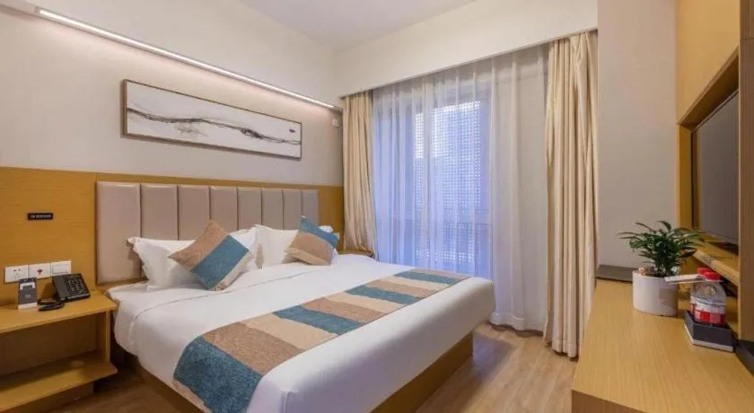 Bed in VX Hotel Wuxi Xinwu District Executive Center Wanda Plaza