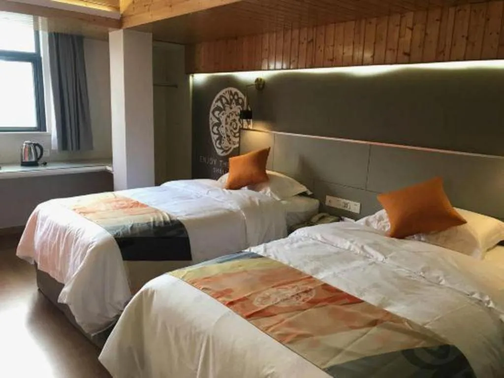 Bed in Shell Hotel Shanghai Minhang District Wenjing Road Metro Station
