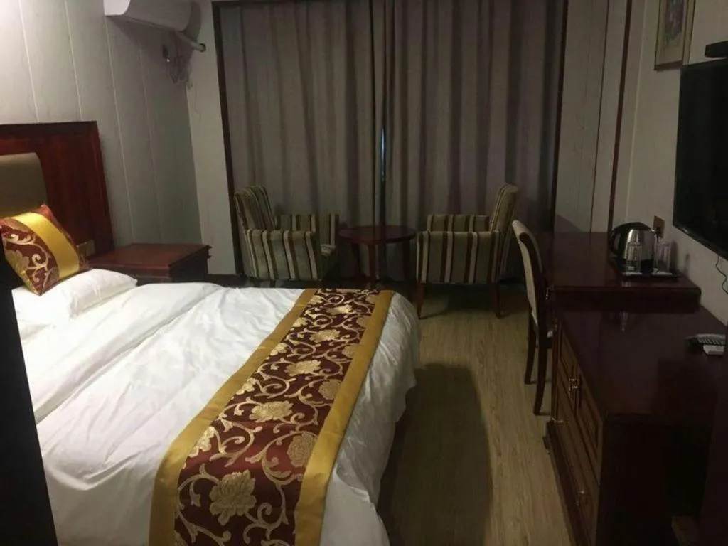 Bed in Shell Hotel Wuxi Jiangyin Zhutang Town