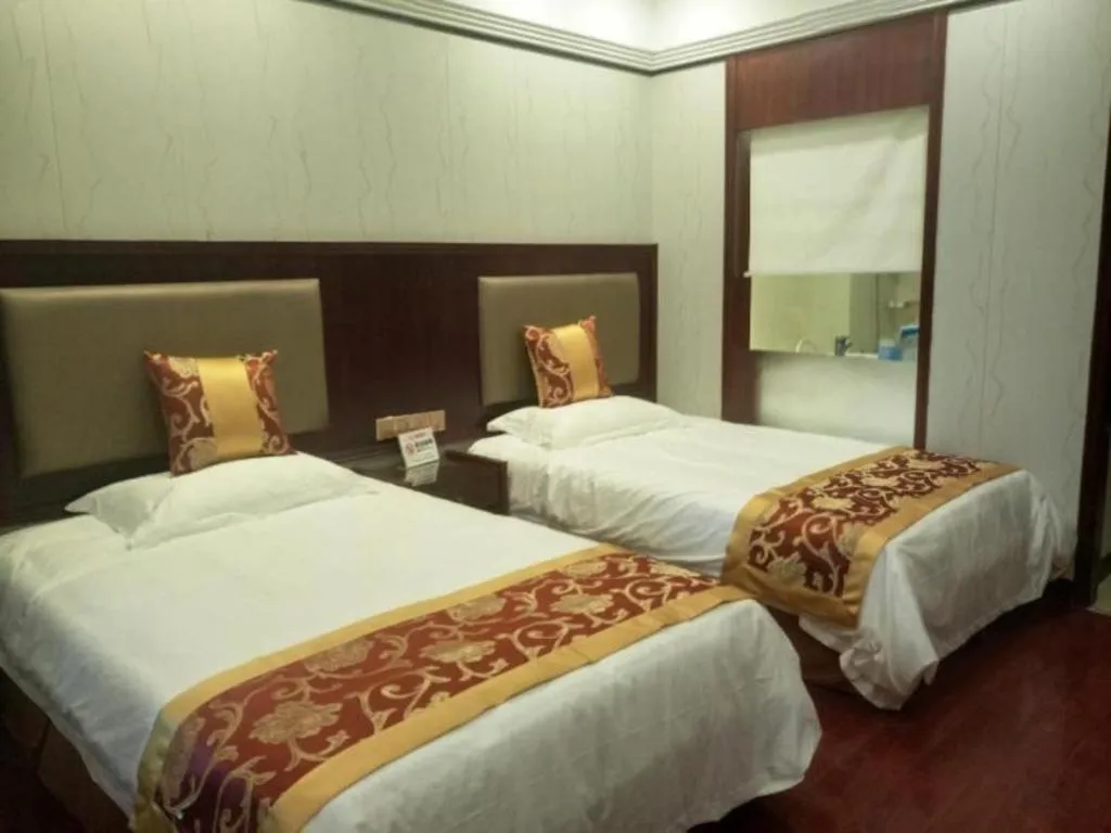 Bed in Shell Hotel Wuxi Jiangyin Zhutang Town