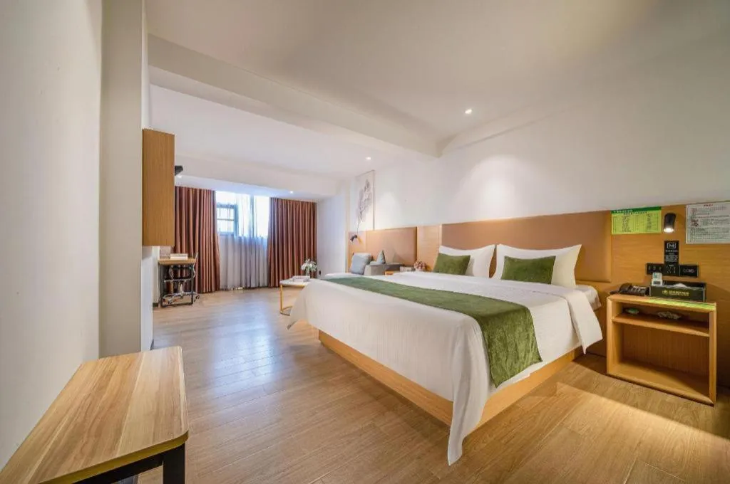 Bed in Green Tree Inn Guangxi Wuzhou 2nd Xinxing Road Liangguang Market