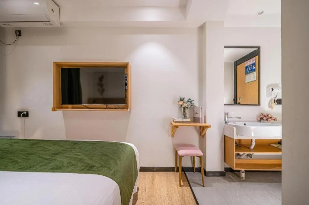 Bed in Green Tree Inn Guangxi Wuzhou 2nd Xinxing Road Liangguang Market