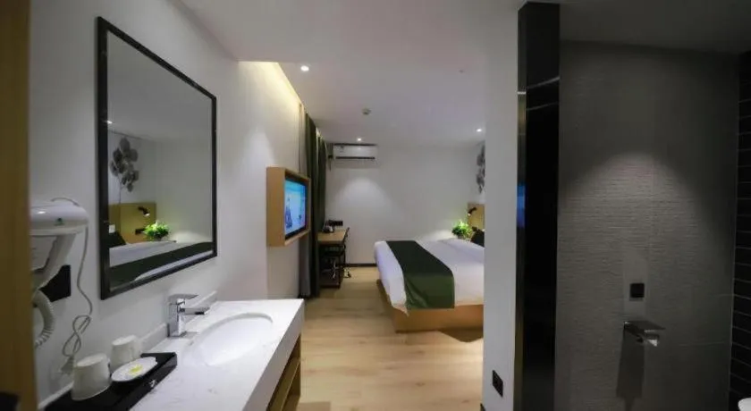 Bed in Green Tree Inn Guangxi Wuzhou 2nd Xinxing Road Liangguang Market