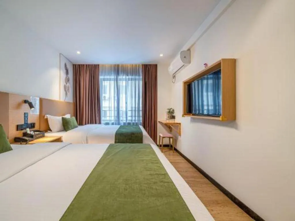 Bed in Green Tree Inn Guangxi Wuzhou 2nd Xinxing Road Liangguang Market