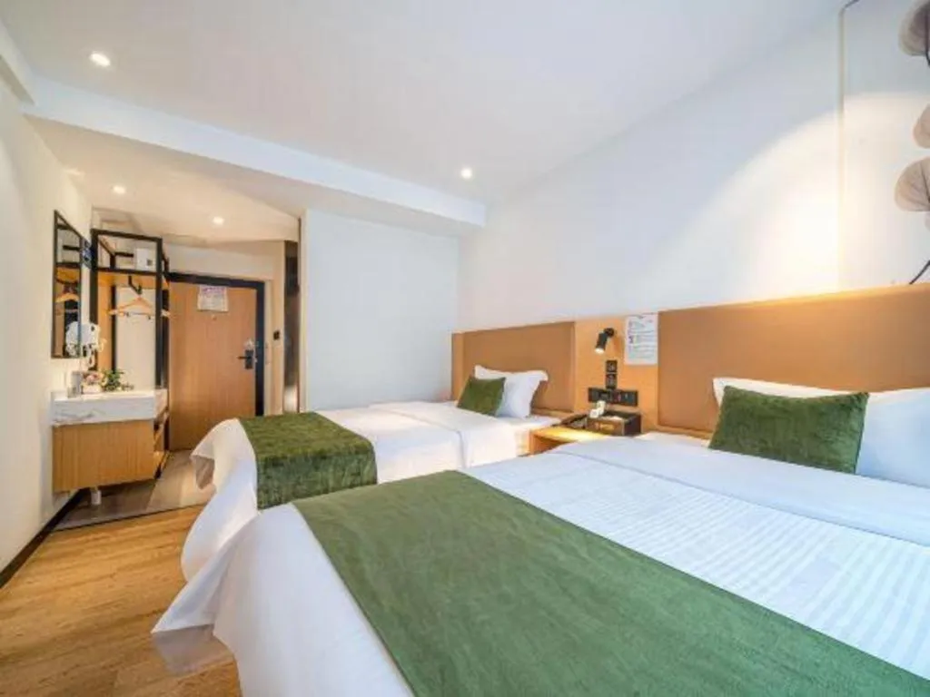 Bed in Green Tree Inn Guangxi Wuzhou 2nd Xinxing Road Liangguang Market