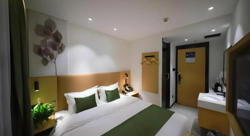 Bed in Green Tree Inn Guangxi Wuzhou 2nd Xinxing Road Liangguang Market