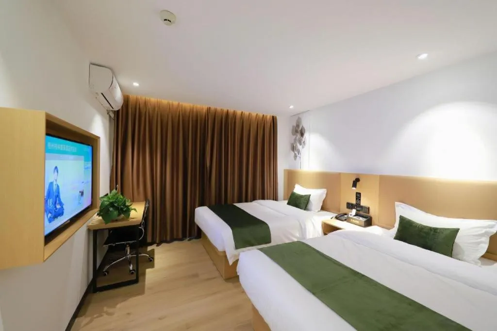 Bed in Green Tree Inn Guangxi Wuzhou 2nd Xinxing Road Liangguang Market