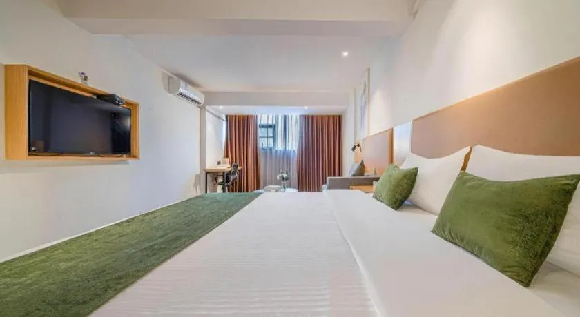 Bed in Green Tree Inn Guangxi Wuzhou 2nd Xinxing Road Liangguang Market