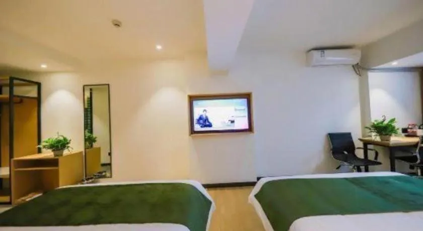 Bed in Green Tree Inn Guangxi Wuzhou 2nd Xinxing Road Liangguang Market