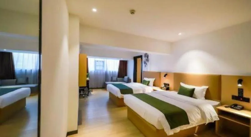 Bed in Green Tree Inn Guangxi Wuzhou 2nd Xinxing Road Liangguang Market