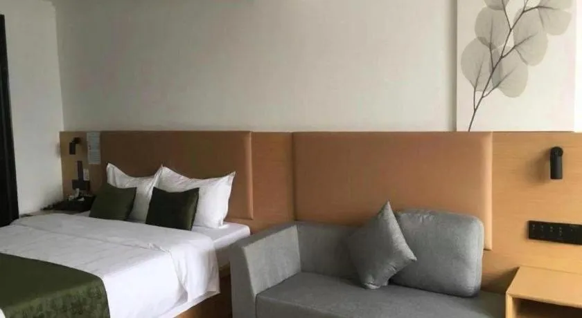 Bed in Green Tree Inn Guangxi Wuzhou 2nd Xinxing Road Liangguang Market