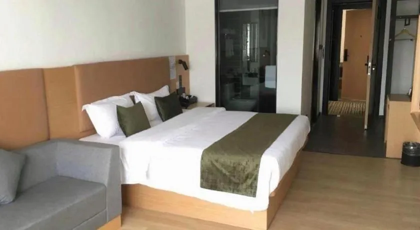 Bed in Green Tree Inn Guangxi Wuzhou 2nd Xinxing Road Liangguang Market