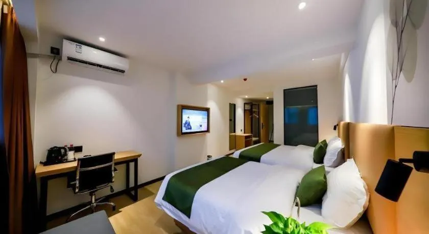 Bed in Green Tree Inn Guangxi Wuzhou 2nd Xinxing Road Liangguang Market