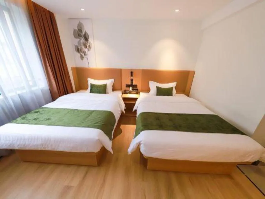 Bed in Green Tree Inn Guangxi Wuzhou 2nd Xinxing Road Liangguang Market