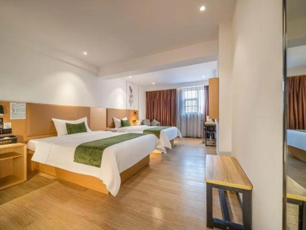 Bed in Green Tree Inn Guangxi Wuzhou 2nd Xinxing Road Liangguang Market