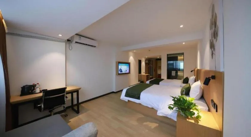 Bed in Green Tree Inn Guangxi Wuzhou 2nd Xinxing Road Liangguang Market