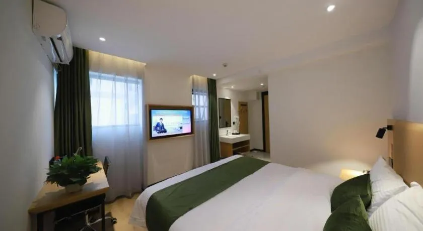 Bed in Green Tree Inn Guangxi Wuzhou 2nd Xinxing Road Liangguang Market
