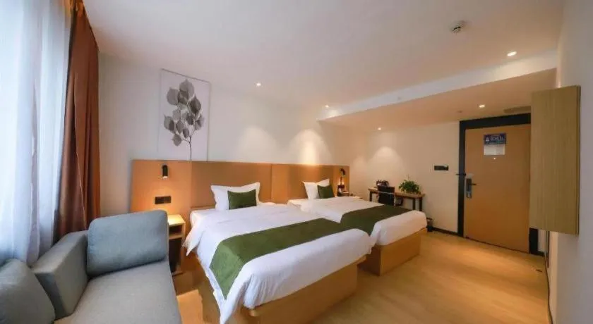 Bed in Green Tree Inn Guangxi Wuzhou 2nd Xinxing Road Liangguang Market