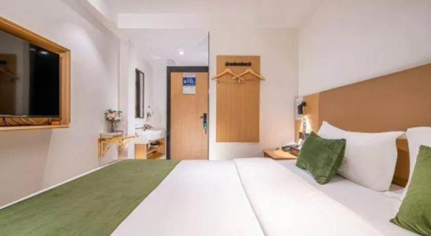 Bed in Green Tree Inn Guangxi Wuzhou 2nd Xinxing Road Liangguang Market