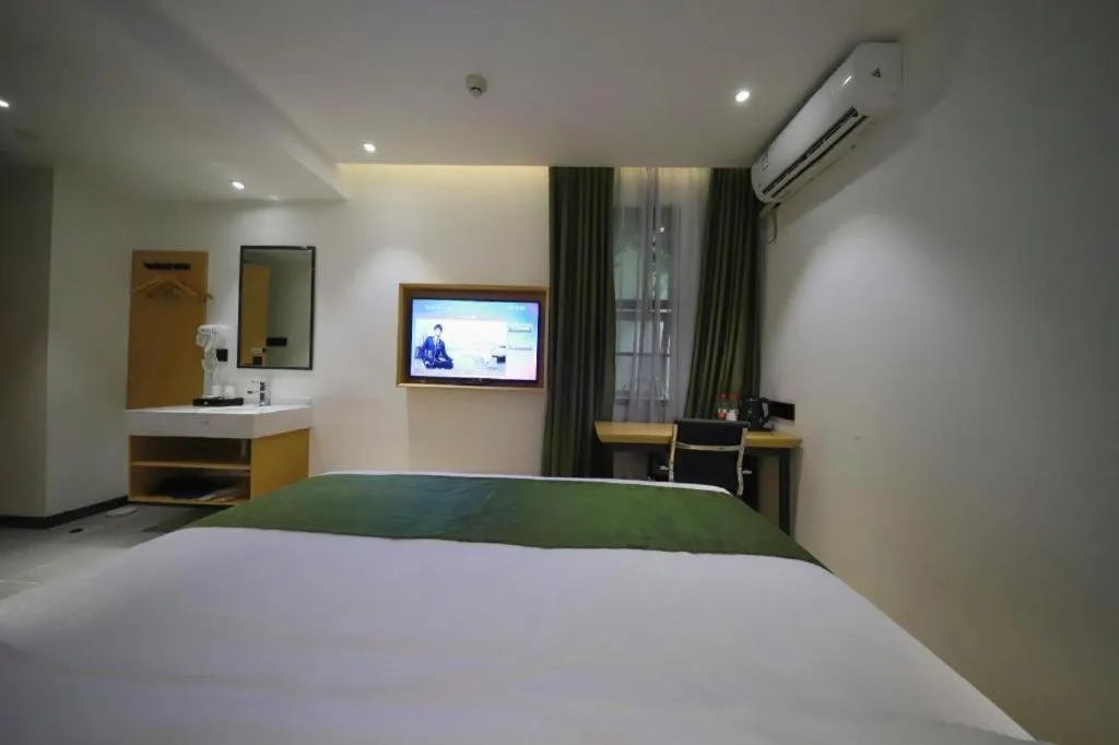 Bed in Green Tree Inn Guangxi Wuzhou 2nd Xinxing Road Liangguang Market