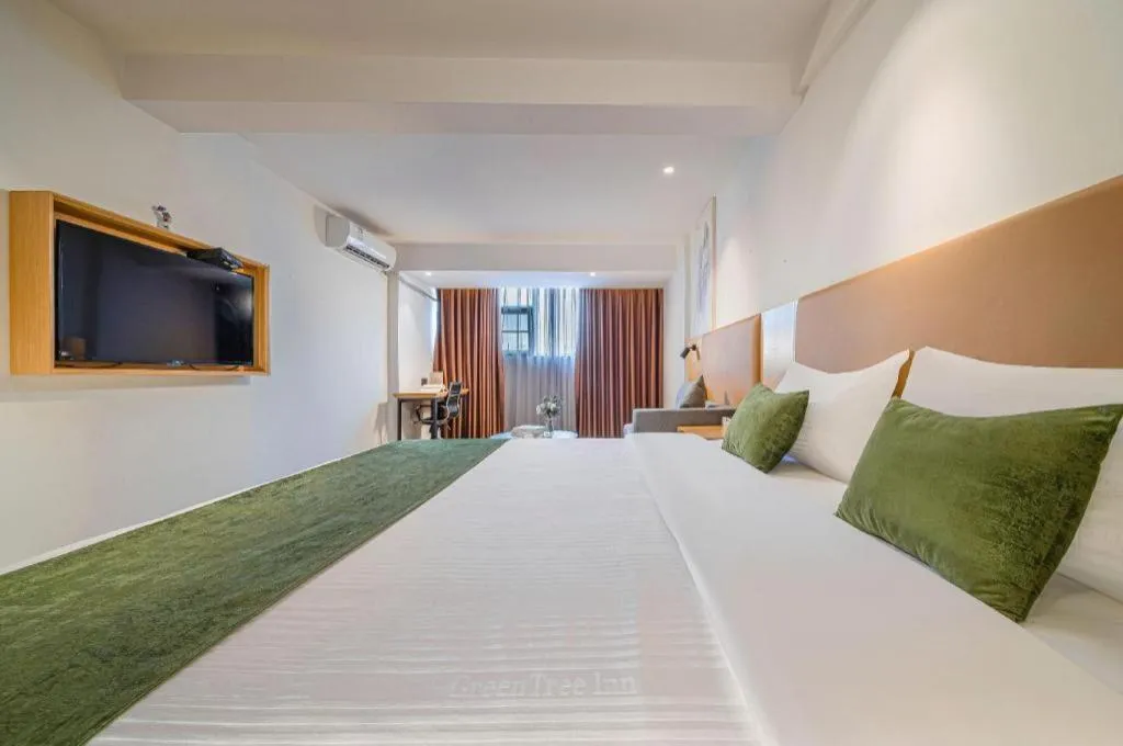 Bed in Green Tree Inn Guangxi Wuzhou 2nd Xinxing Road Liangguang Market