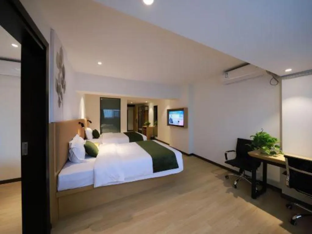 Bed in Green Tree Inn Guangxi Wuzhou 2nd Xinxing Road Liangguang Market