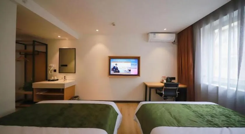 Bed in Green Tree Inn Guangxi Wuzhou 2nd Xinxing Road Liangguang Market