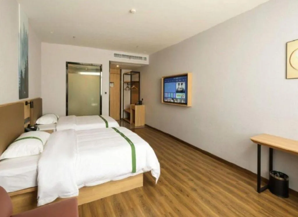 Bed in Green Tree Inn Guangxi Wuzhou 2nd Xinxing Road Liangguang Market