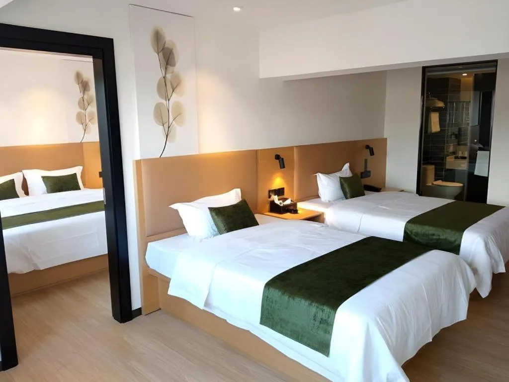 Bed in Green Tree Inn Guangxi Wuzhou 2nd Xinxing Road Liangguang Market