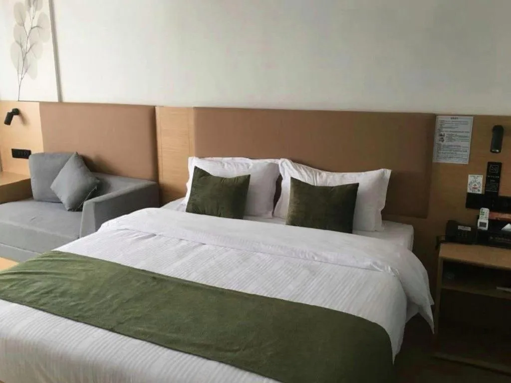 Bed in Green Tree Inn Guangxi Wuzhou 2nd Xinxing Road Liangguang Market